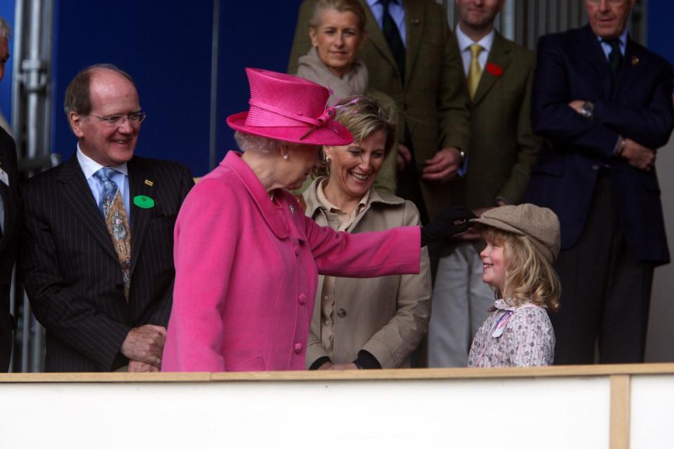 This time she fussed with Lady Louise's hat.