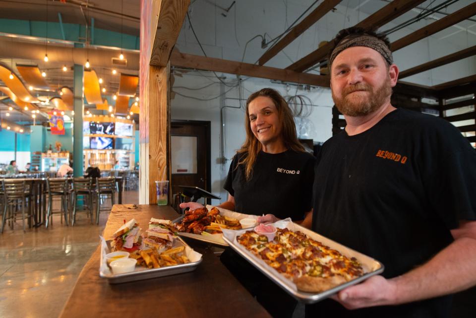 New flavors from flatbread pizza to award-winning wings and smoked brisket are now available at Happy Bassett Barrel House thanks to Tim and Kristin Miller, owners of Beyond Q BBQ. Here, they show some of their new menu items.