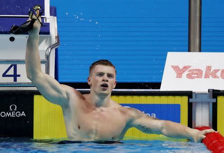 Swimming – 17th FINA World Aquatics Championships – Men's 100m Breaststroke final – Budapest, Hungary – July 24, 2017 – Adam Peaty of Britain reacts after coming first. REUTERS/Laszlo Balogh