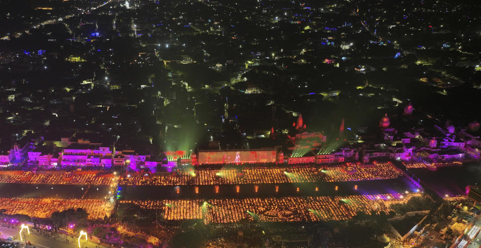 Lamps light up the banks of the river Saryu on the eve of the Hindu festival of Diwali, in Ayodhya, India, Saturday, Nov. 11, 2023. Ayodhya city in the northern Indian state of Uttar Pradesh Saturday set a record by lighting over 2.2 million earthen oil lamps during Deepotsav celebrations on the eve of Diwali, creating a new Guinness World Record for lighting lamps in such a large number, according to state tourism department. (AP Photo/Rajesh Kumar Singh)