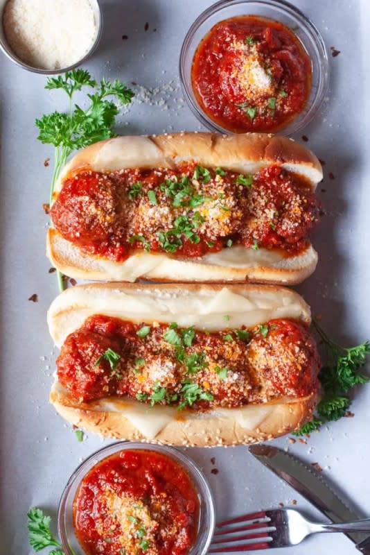<p>Daily Appetite</p><p>The slow cooker does all the work of cooking meatballs in the marinara sauce so you can assemble sandwiches and get back to the game.</p><p><strong>Get the recipe: <a href="https://dailyappetite.com/crockpot-meatball-subs/" rel="nofollow noopener" target="_blank" data-ylk="slk:Crock Pot Meatball Subs;elm:context_link;itc:0;sec:content-canvas" class="link rapid-noclick-resp">Crock Pot Meatball Subs</a></strong></p>