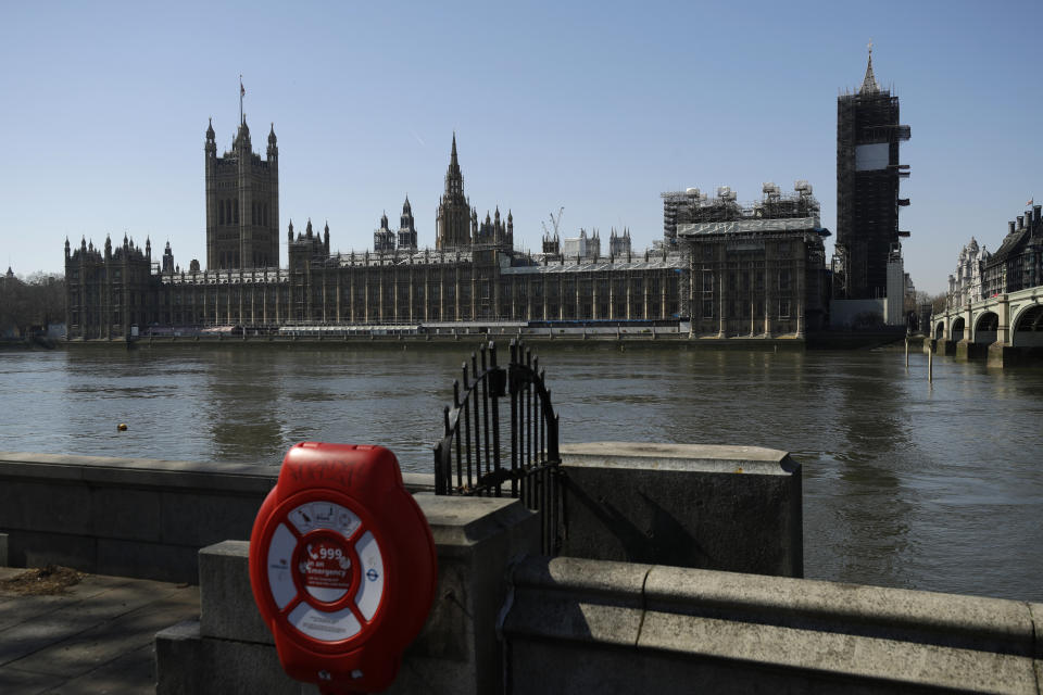 FILE - A general view of the Hoses of Parliament seen from the south bank of the River Thames in London, March 25, 2020. Boris Johnson has stepped down as Conservative Party leader, but the scandal-tarnished politician remains Britain’s prime minister — for now. Johnson’s resignation sparks a party contest to replace him as leader. All Conservative lawmakers are eligible to run, and party officials could open the nominations within hours. (AP Photo/Matt Dunham, file)