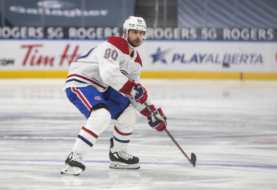 Montreal Canadiens' Tomas Tatar (90) plays against the Edmonton Oilers during first-period NHL hockey game action in Edmonton, Alberta, Saturday, Jan. 16, 2021. (Jason Franson/The Canadian Press via AP)