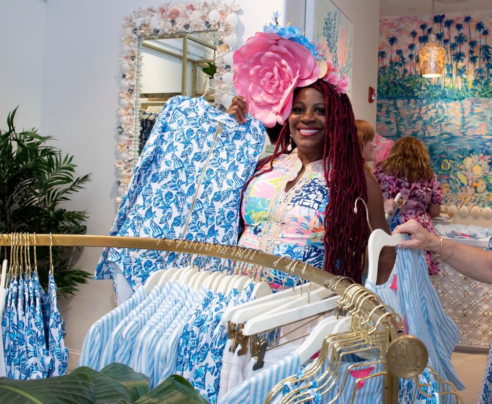 Lilly Pulitzer enthusiast Vee Herman, of Broward County, attends the launch of Barefoot in Paradise by Liza and Minnie Pulitzer at the Lilly Pulitzer Worth Avenue store on Tuesday.