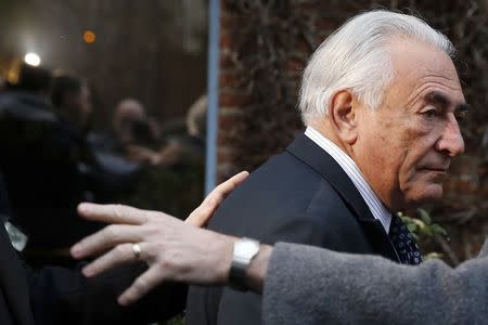 Former IMF head Dominique Strauss-Kahn leaves his hotel to attend the trial in the so-called Carlton Affair, in Lille, February 17, 2015, where 14 people including Strauss-Kahn stand accused of sex offences including the alleged procuring of prostitutes. Strauss-Kahn is charged with "procuring with aggravating circumstances". REUTERS/Pascal Rossignol