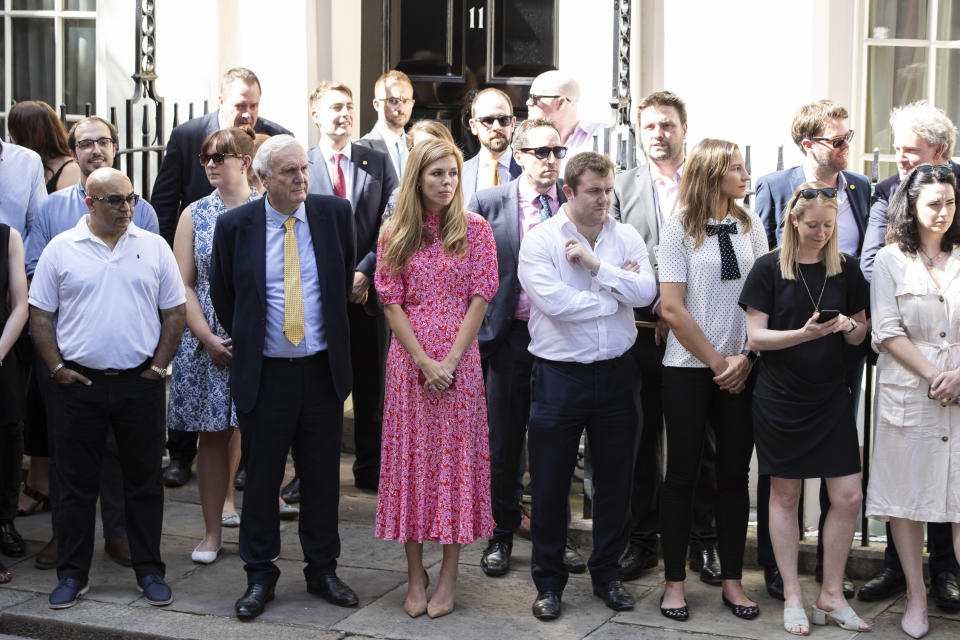 LONDON, ENGLAND - JULY 24: New Prime Minister Boris Johnson's girlfriend Carrie Symonds (centre) waits for Boris to arrive at Number 10, Downing Street on July 24, 2019 in London, England. Boris Johnson, MP for Uxbridge and South Ruislip, was elected leader of the Conservative and Unionist Party yesterday receiving 66 percent of the votes cast by the Party members. He takes the office of Prime Minister this afternoon after outgoing Prime Minister Theresa May took questions in the House of Commons for the last time. (Photo by Dan Kitwood/Getty Images)