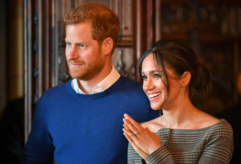 Harry and Meghan watch a performance by a Welsh choir in the banqueting hall during a visit to Cardiff Castle on Jan. 18, 2018, in Cardiff, Wales. (Photo: WPA Pool via Getty Images)