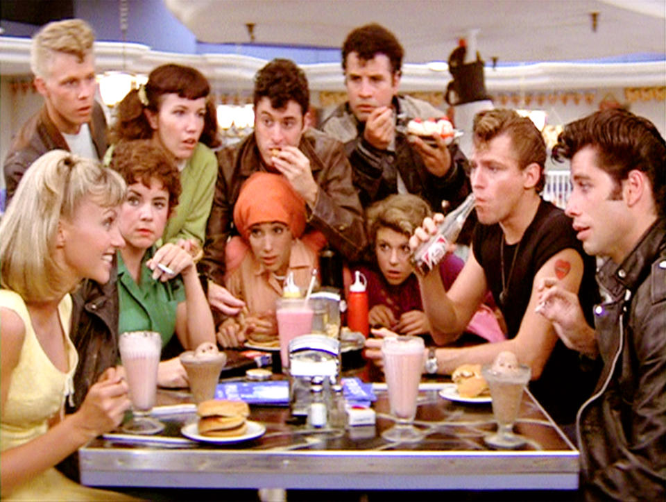 LOS ANGELES - JUNE 16: The movie "Grease", directed by Randal Kleiser. Seen here at the malt shop, the Pink Ladies and the T-Birds. In back from left, Kelly Ward (as Putzie), Jamie Donnelly (as Jan), Barry Pearl (as Doody) and Michael Tucci (as Sonny). Seated, from left, Olivia Newton-John (as Sandy), Stockard Channing (as Rizzo), Didi Conn (as Frenchy), Dinah Manoff (as Marty), Jeff Conaway (as Kenickie) and John Travolta (as Danny). Initial theatrical release of the film, June 16, 1978. Screen capture. Paramount Pictures. (Photo by CBS via Getty Images)