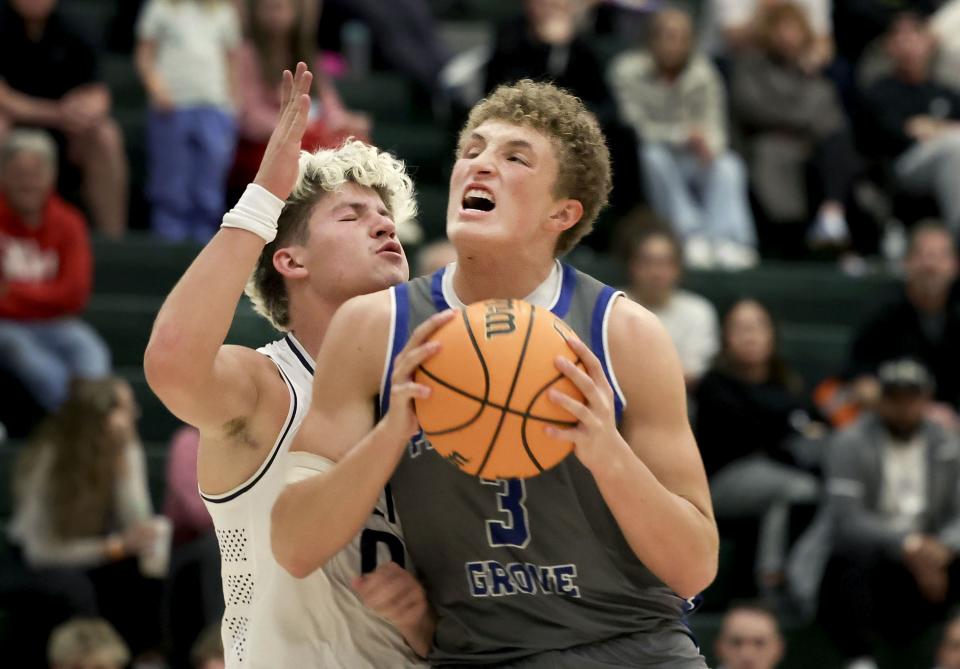 Pleasant Grove’s Makai Peterson drives past Brighton’s Nash Matheson in a neutral tournament game at Olympus High School in Holladay on Thursday, Dec. 28, 2023. | Laura Seitz, Deseret News