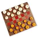 <p>Paint 32 squares on a large (roughly 30-inch) wood board with burnt orange craft paint. Use mini white and orange pumpkins as game pieces.</p>