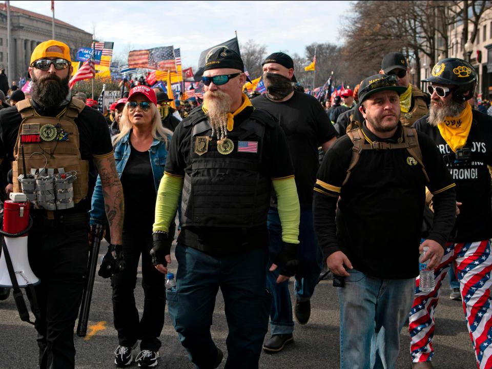 <p>In this file photo taken on 12 December 2020, members of the Proud Boys join supporters of then US President Donald Trump as they demonstrate in Washington, DC</p> ((AFP via Getty Images))