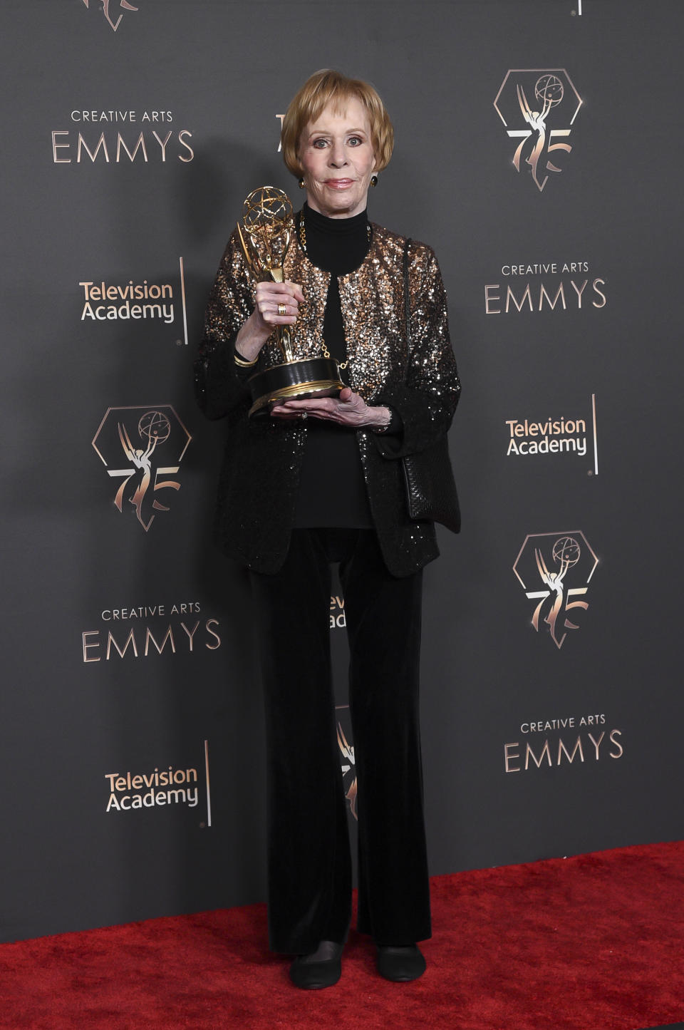 Carol Burnett pose in the press room with the award for outstanding variety special (Pre-Recorded) for "Carol Burnett: 90 Years Of Laughter and Love" during night two of the Creative Arts Emmy Awards on Sunday Jan. 7, 2024, at the Peacock Theater in Los Angeles. (Photo by Richard Shotwell/Invision/AP)