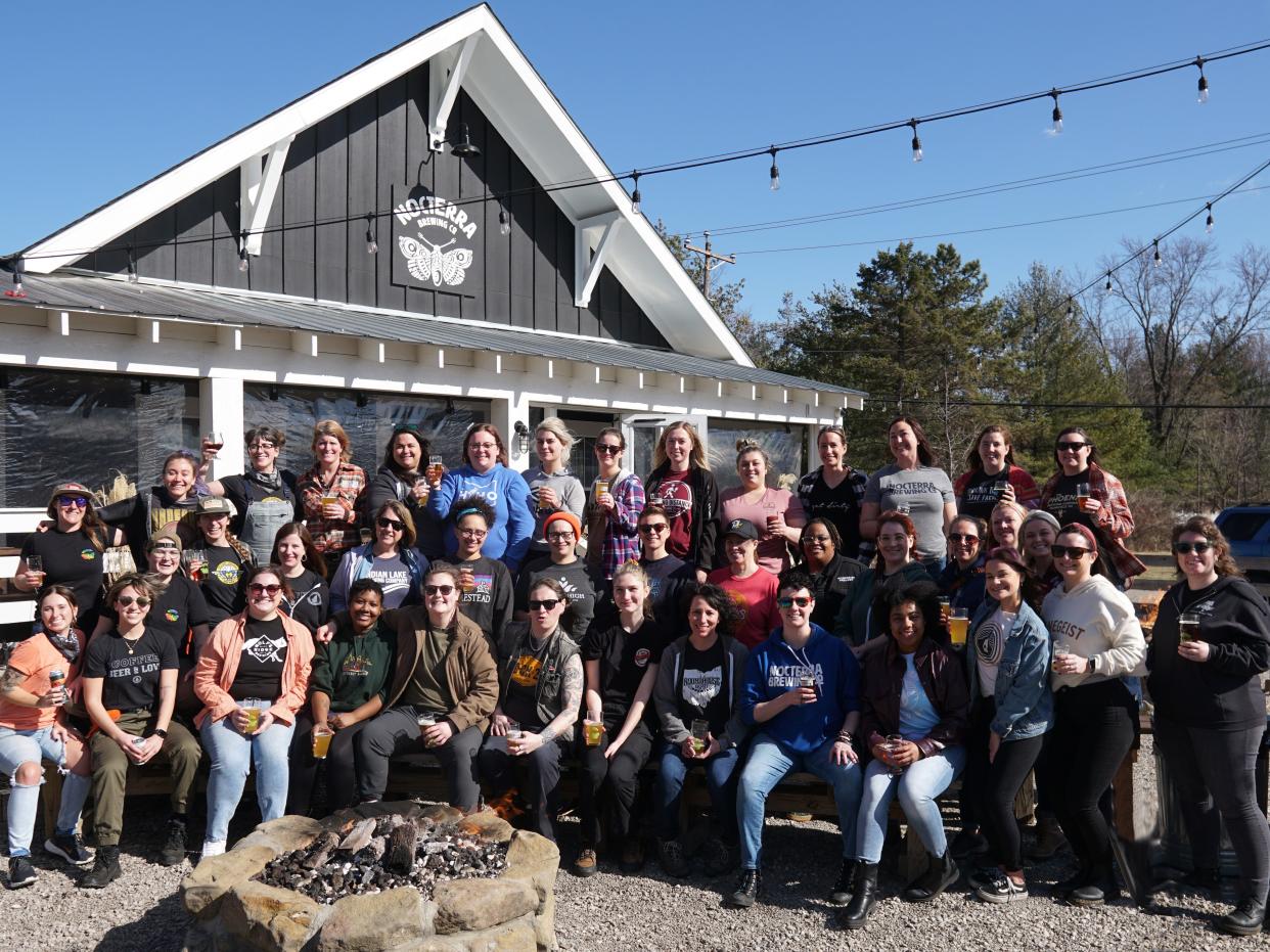 A group poses at Nocterra Brewing to celebrate All Places, a beer collaboration for International Women’s Day.