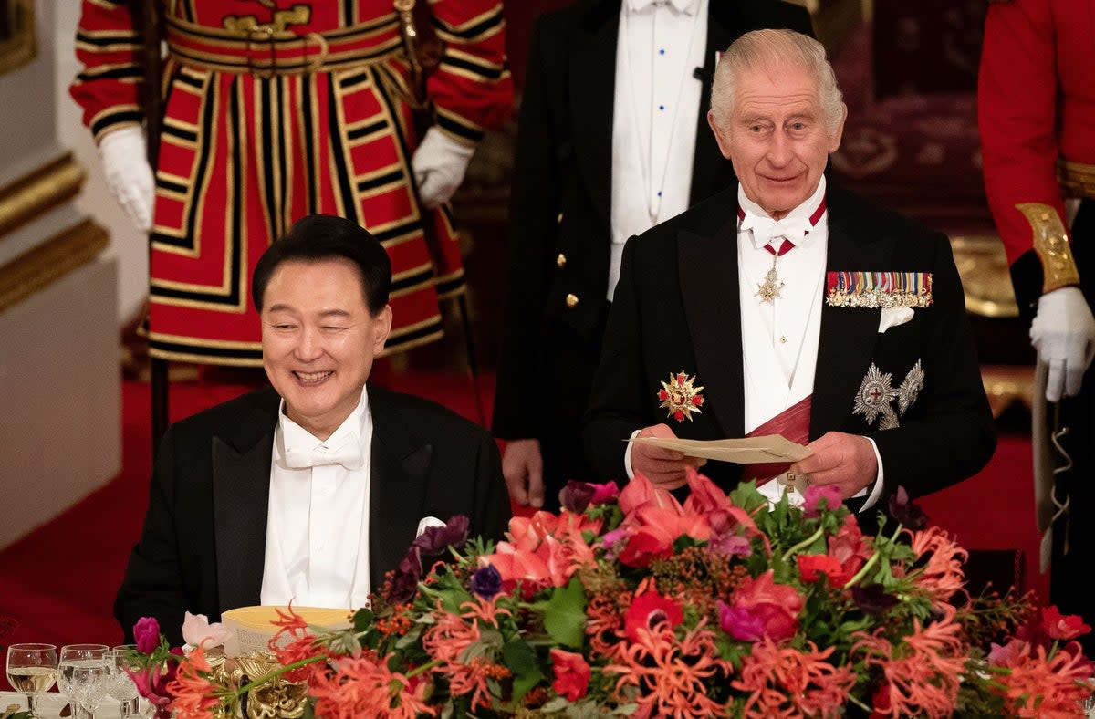 President of South Korea Yoon Suk Yeol listens as King Charles III speaks at the state banquet at Buckingham Palace, London (PA)