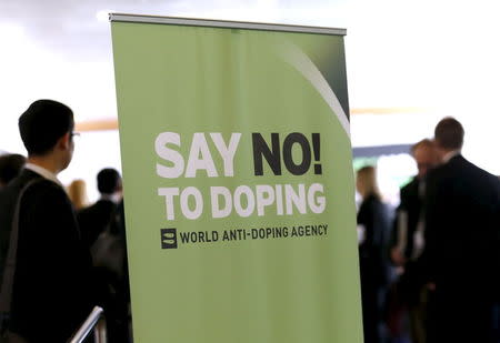 Participants talk before the start of the World Anti-Doping Agency (WADA) Symposium for Anti-Doping Organizations in Lausanne, Switzerland, in this March 24, 2015 file photo. REUTERS/Denis Balibouse/Files