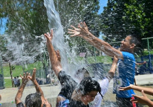 Children cool off at a water park in Alhambra, California on July 27, 2019