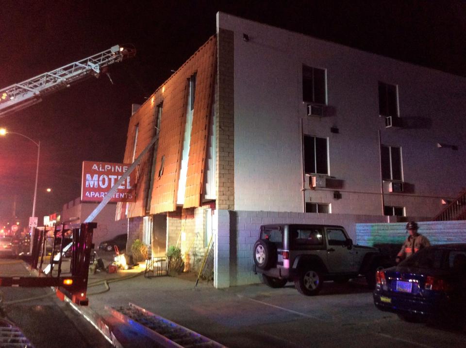 This photo provided by the Las Vegas Fire Department, firefighters work the scene of a fire at a three-story apartment complex early Saturday, Dec. 21, 2019 in Las Vegas.