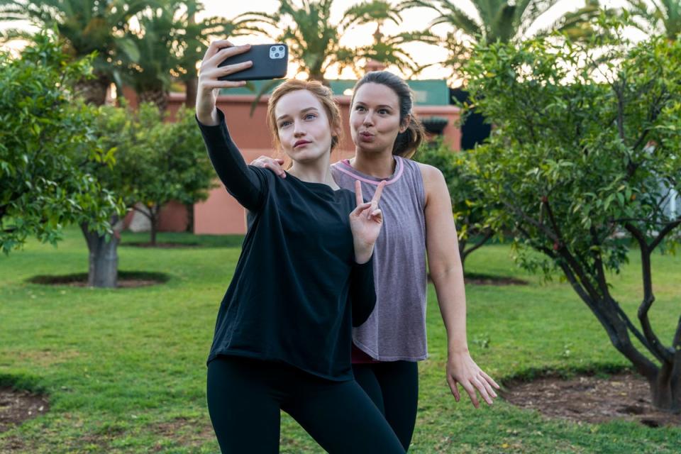 Actor Julia Garner poses with Katie Knowles, who plays Ms Williams (NICOLE RIVELLI/NETFLIX)