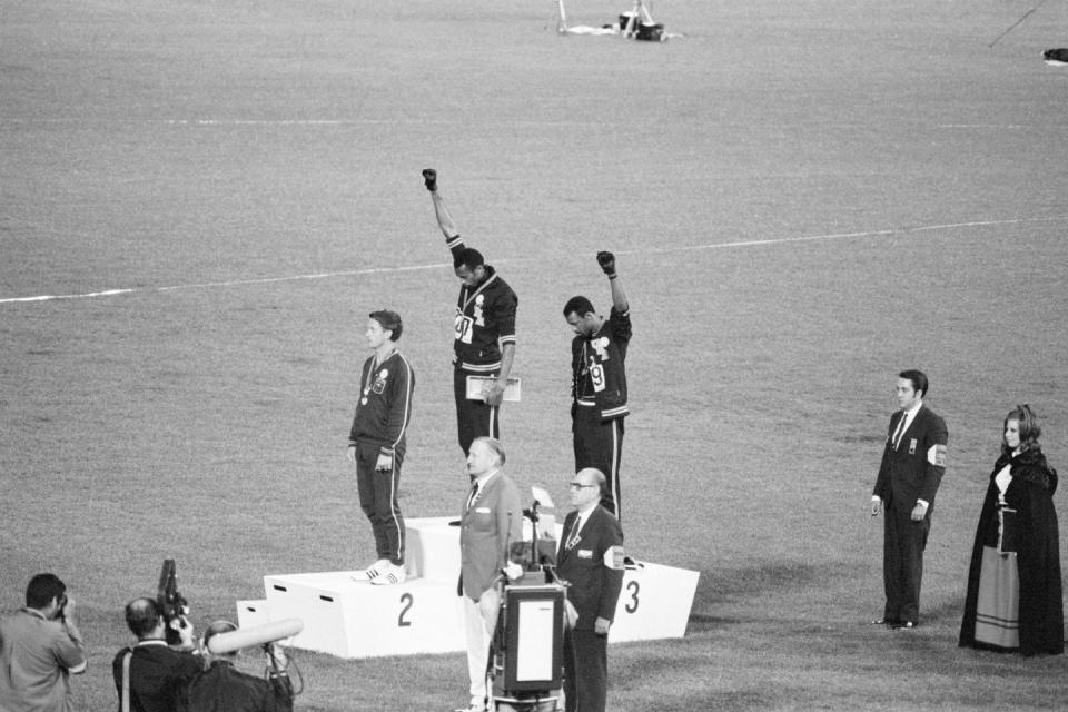 <p>Tommie Smith and John Carlos, gold and bronze medalists in the 200-meter run at the 1968 Olympic Games, engage in a victory stand protest against the oppression of Black people in the United States. With heads lowered and fists raised in the Black power salute, they refuse to recognize the American flag and national anthem. Australian Peter Norman is the silver medalist.</p><p><strong>RELATED: </strong><a href="https://www.redbookmag.com/life/news/a48951/kindergartner-recreated-iconic-women-black-history-month/" rel="nofollow noopener" target="_blank" data-ylk="slk:This Kindergartner Dressed Up As Iconic Black Women Every Day of Black History Month;elm:context_link;itc:0;sec:content-canvas" class="link "><strong>This Kindergartner Dressed Up As Iconic Black Women Every Day of Black History Month</strong></a></p>