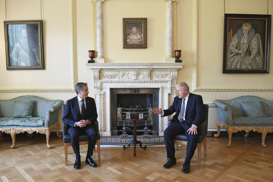 Britain's Prime Minister Boris Johnson, right, and US Secretary of State Antony Blinken inside 10 Downing Street in London, Tuesday, May 4, 2021. Foreign ministers from the Group of Seven wealthy industrialized nations gathered in London to grapple with threats to health, prosperity and democracy. It is their first face-to-face meeting in more than two years. (Stefan Rousseau/Pool via AP)