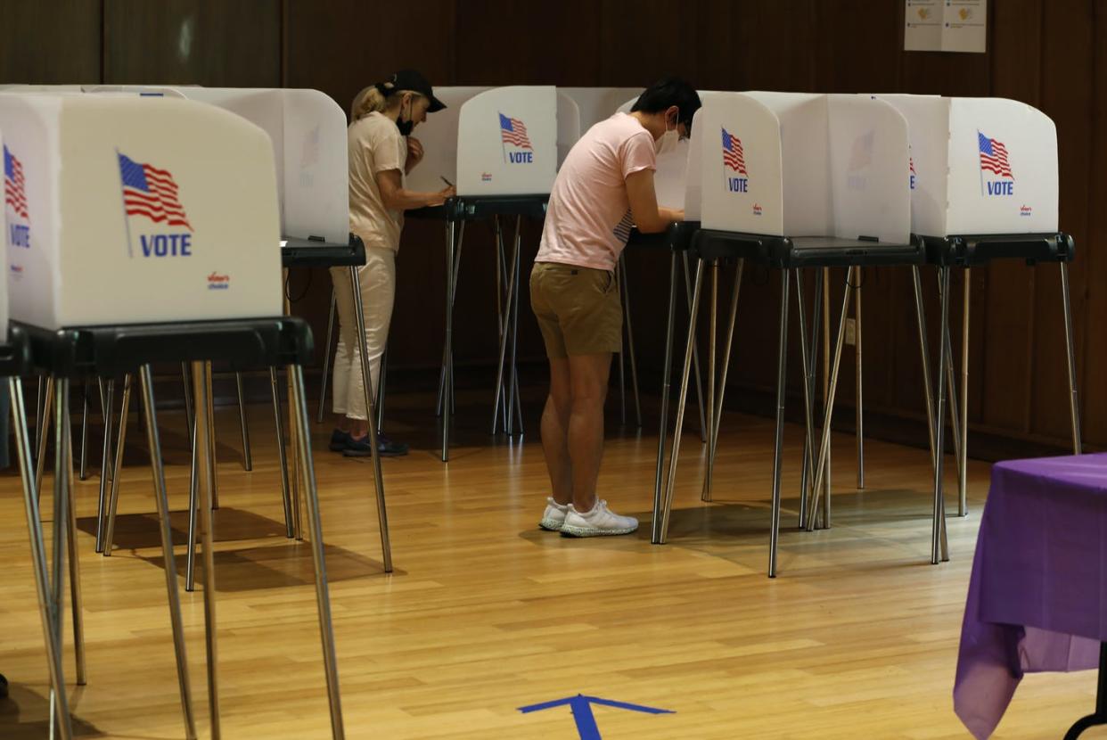 People vote in the primary election at the civic center in Silver Spring, Md., on July 19, 2022. <a href="https://www.gettyimages.com/detail/news-photo/people-vote-at-the-silver-spring-civic-center-on-july-19-news-photo/1242008567?adppopup=true" rel="nofollow noopener" target="_blank" data-ylk="slk:Robb Hill for The Washington Post via Getty Images;elm:context_link;itc:0;sec:content-canvas" class="link ">Robb Hill for The Washington Post via Getty Images</a>