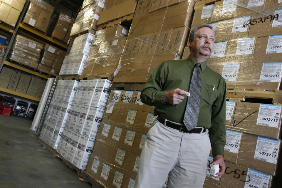 FILE - In this April 29, 2009, file photo, Don Wood, an official with the Strategic National Stockpile, awaits another truck load of medications in Salt Lake City, Utah during a swine flu outbreak from the H1N1 virus. The 2009 H1N1 pandemic prompted the largest use to date of the stockpile, which was created in 1999. It has never confronted anything on the scale of the current COVID-19 pandemic. (AP Photo/Francisco Kjolseth, Pool)