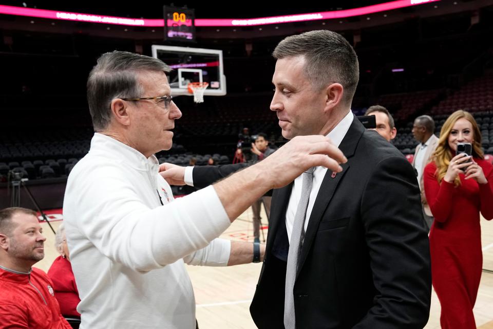 Mar 18, 2024; Columbus, OH, USA; Ohio State basketball head coach Jake Diebler hugs his dad, Keith, during his introductory press conference at Value City Arena.