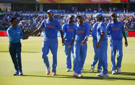 Members of India's World Cup cricket team leave the field after dismissing United Arab Emirates for just 102 runs, the lowest score against India in world cups, at the Cricket World Cup in Perth, February 28, 2015. REUTERS/David Gray