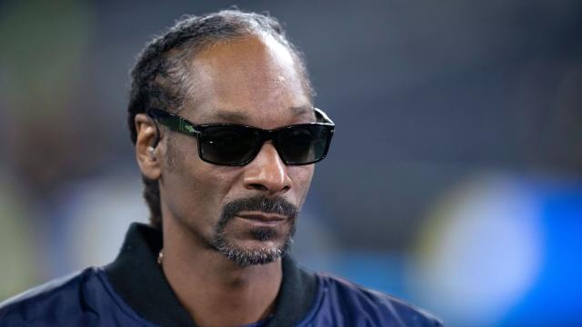 Snoop Dogg enjoys some bud before performing at Super Bowl halftime show