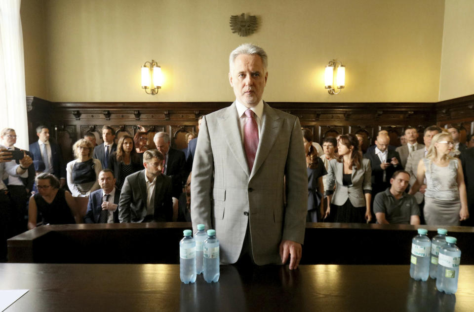 Ukrainian oligarch Dymitro Firtash waits for the start of his trial at the Austrian supreme court in Vienna, Austria, Tuesday, June 25, 2019. Austrian supreme court rules on extradition case of Ukrainian oligarch Dymitro Firtash to the US. (AP Photo/Ronald Zak)