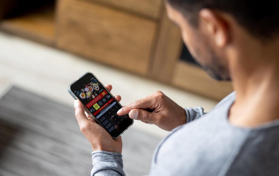 man gambling on his cellphone