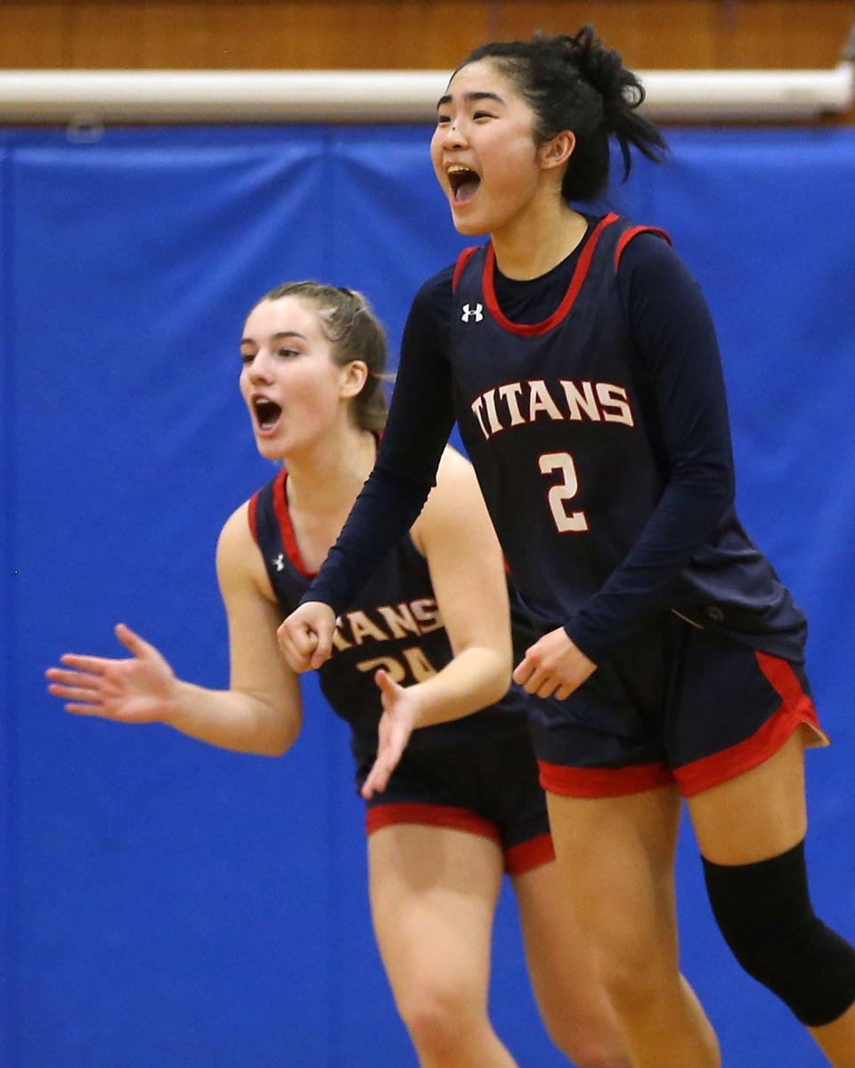 Pembroke's Elli Tam and Pembroke's Allie Dwyer celebrate their 45-43 win over Scituate at Scituate High on Friday, Jan. 27, 2023. 