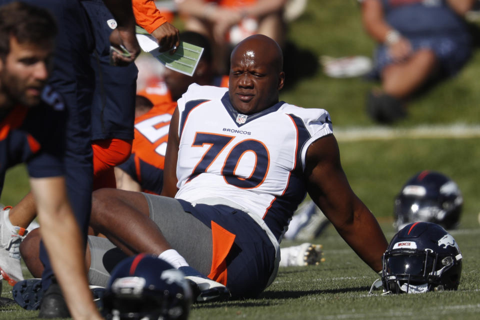 FILE - In this July 19, 2019, file photo, Denver Broncos offensive tackle Ja'Wuan James (70) stretches during NFL football training camp in Englewood, Colo. More than half of the 67 NFL players who opted out of the 2020 season amid the COVID-19 pandemic are no longer with the same team and almost two dozen aren't on anyone's roster. Among last year's opt outs who have landed with other teams is right tackle Ja'Wuan James, who signed with the Ravens after his unceremonious departure from Denver. (AP Photo/David Zalubowski, File)