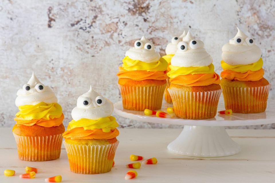 <p>Mimic the layers of candy corn you love so much with these adorable cupcakes.</p><p>Get the recipe from <a href="https://www.delish.com/cooking/recipe-ideas/recipes/a43940/candy-corn-ghost-cupcakes-recipe/" rel="nofollow noopener" target="_blank" data-ylk="slk:Delish;elm:context_link;itc:0;sec:content-canvas" class="link ">Delish</a>.</p>