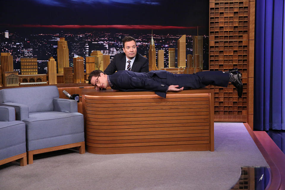 Andy Samberg planking on Jimmy Fallon's desk