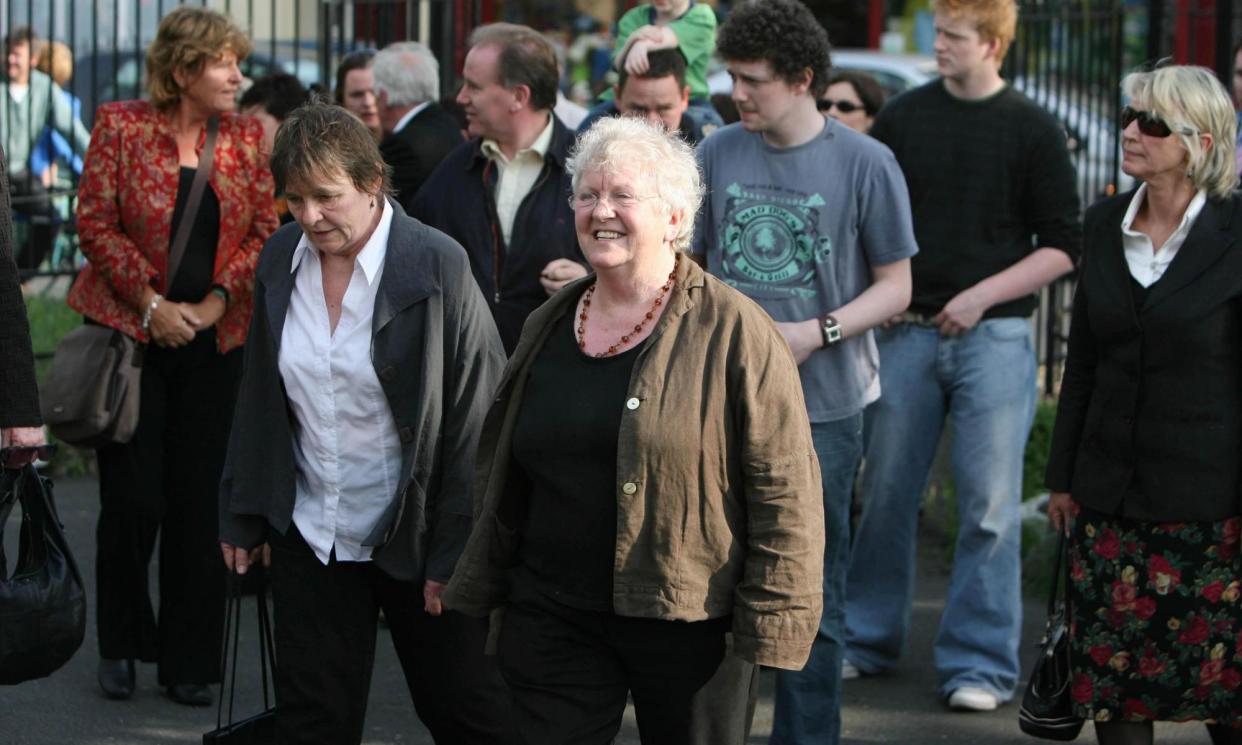 <span>Nell McCafferty (centre) at the funeral removal service for her former long-term partner, novelist Nuala O'Faolain, in 2008.</span><span>Photograph: PA Images/Alamy</span>