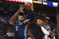 Memphis Grizzlies center Xavier Tillman (2) shoots against Philadelphia 76ers forward Paul Reed Jr. during the first quarter of an NBA summer league basketball game Tuesday, July 5, 2022, in Salt Lake City. (AP Photo/Jeff Swinger)