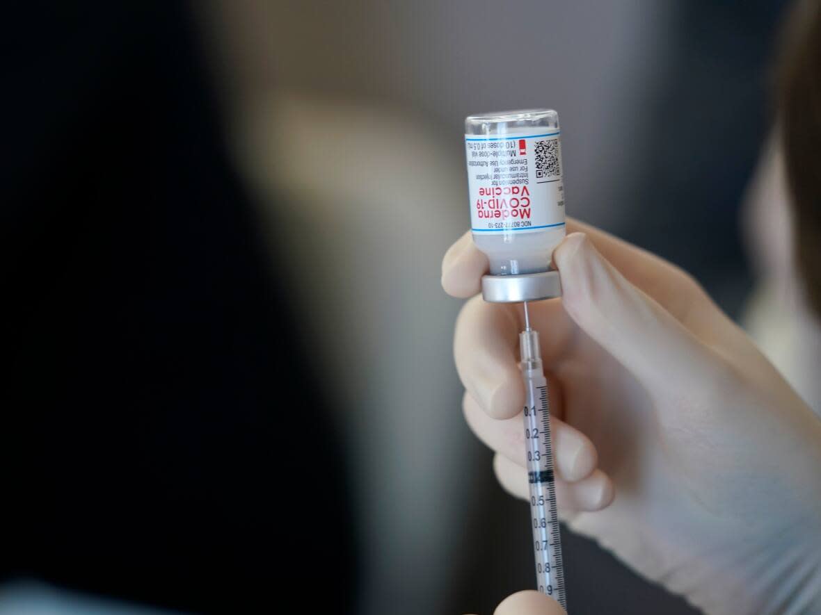 The Saskatchewan government has received reports of 1,155 reports of people experiencing adverse effects from vaccinations. That's 0.004 per cent of all shots given out. (Gerald Herbert/The Associated Press - image credit)
