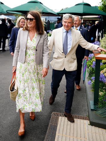 <p>Zac Goodwin/PA Images via Getty</p> Carole Middleton and Michael Middleton arrive at Wimbledon on July 10, 2024.