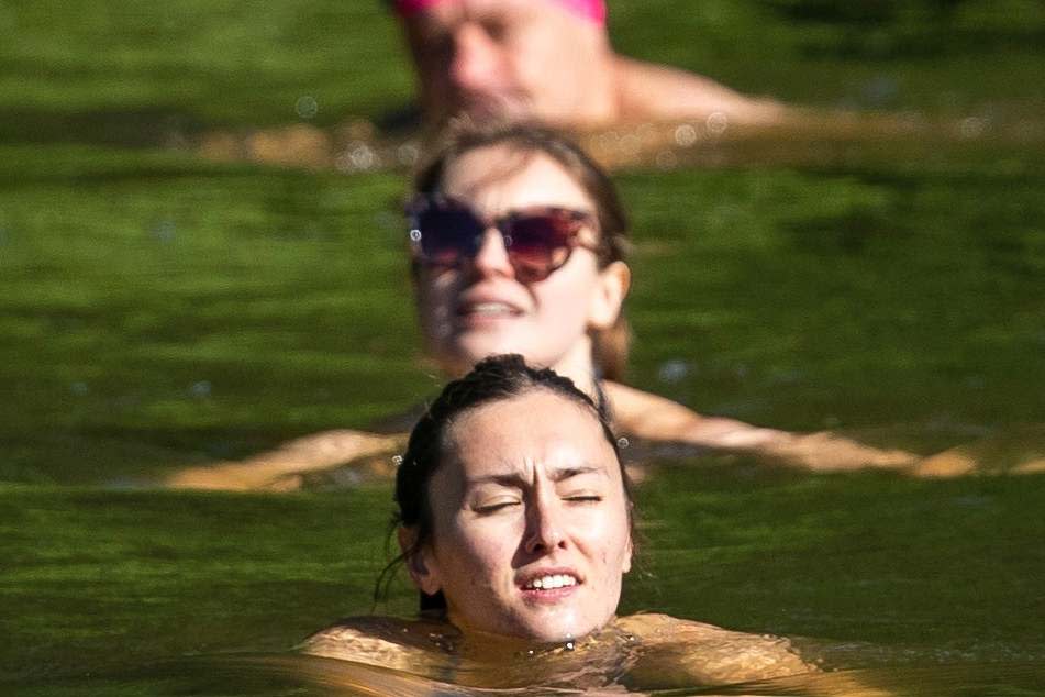 Swimmers in one of Hampstead Heath ponds (PA)