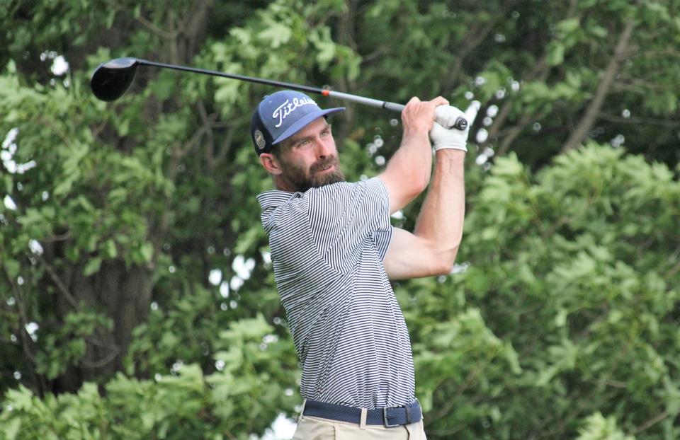 Patrick Wilkes-Krier of Ann Arbor watches a shot during Wednesday’s play in the Michigan Open, where he maintained his three-day lead and grew it by five strokes.