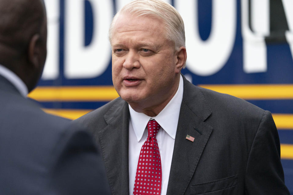 FILE - Senatorial candidate Mike Gibbons speaks with supporters during a campaign rally in Maineville, Ohio, Jan. 14, 2022. As war rages in Ukraine, ties to business deals involving Russia are threatening potential political fallout to candidates in Ohio's crowded Republican primary for an open U.S. Senate seat. (AP Photo/Jeff Dean, File)