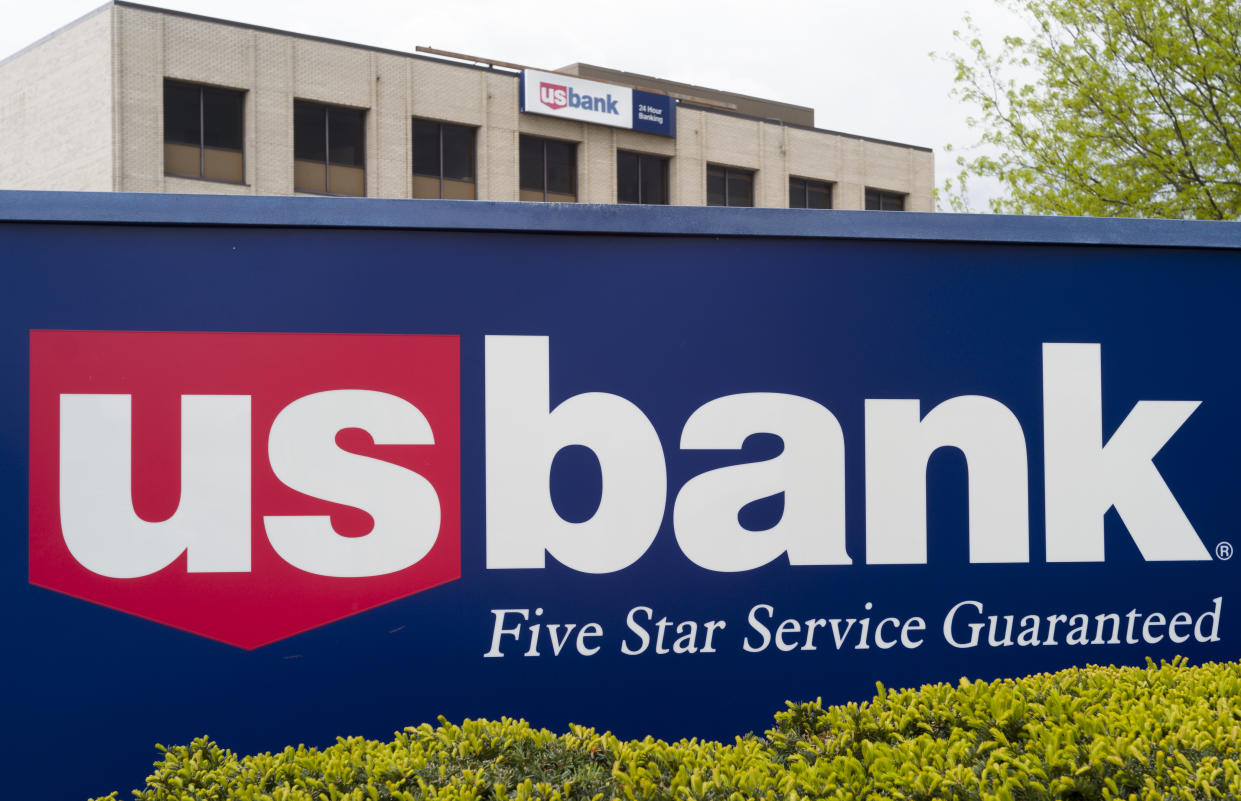FILE- This May 3, 2017, file photo shows a U.S. Bank branch in Omaha, Neb. U.S. Bancorp said Thursday, Feb. 15, 2018, that it will pay $613 million in fines and penalties to settle allegations that the bank had poor anti-money laundering controls. (AP Photo/Nati Harnik, File)