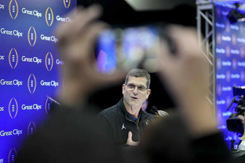 Michigan head coach Jim Harbaugh is interviewed during media day ahead of the national championship NCAA College Football Playoff game between Washington and Michigan Saturday, Jan. 6, 2024, in Houston. The game will played Monday. (AP Photo/David J. Phillip)