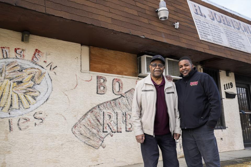 Tue., Feb. 1, 2022; Columbus, Ohio, USA; Herbie Johnson Sr., left, and Herbie Johnson Jr., right, pose for a portrait outside of H. Johnson Bar-B-Q in the Driving Park neighborhood. Johnson Sr. opened the restaurant 45 years ago with his wife, Sandra. The neighborhood fixture closed during the pandemic.