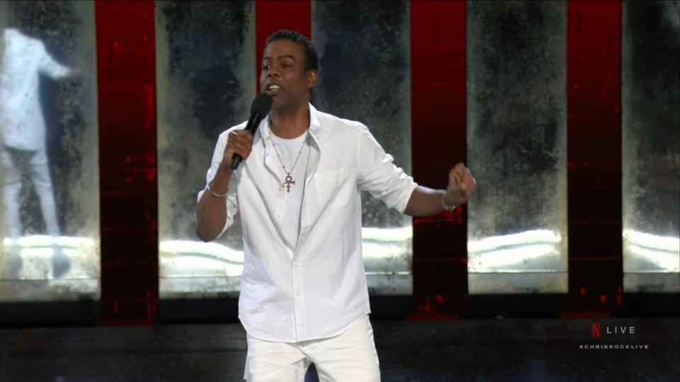 Chris Rock doing stand-up in front of a live audience in Baltimore.