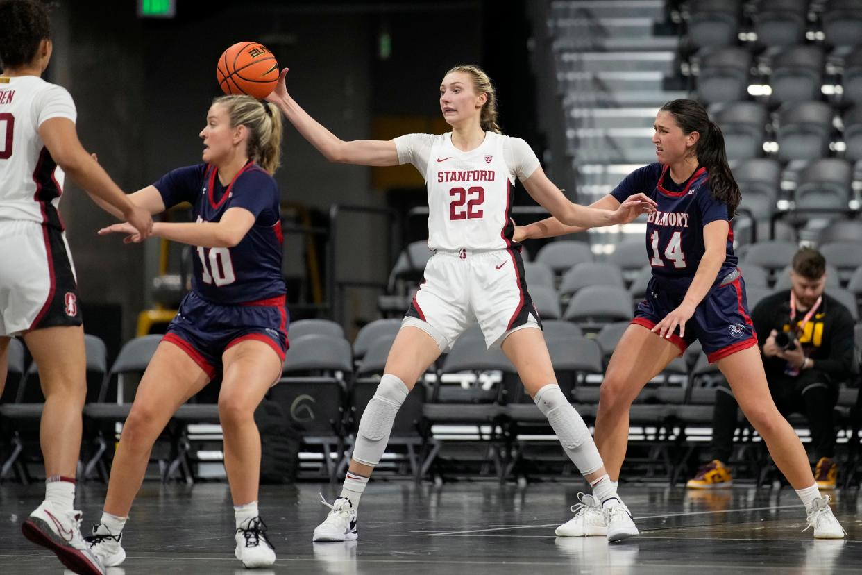 Stanford forward Cameron Brink (22) passes around Belmont forward Kendal Cheesman (14) during the second half of the game Wednesday, Nov. 22, 2023, in Henderson, Nevada.