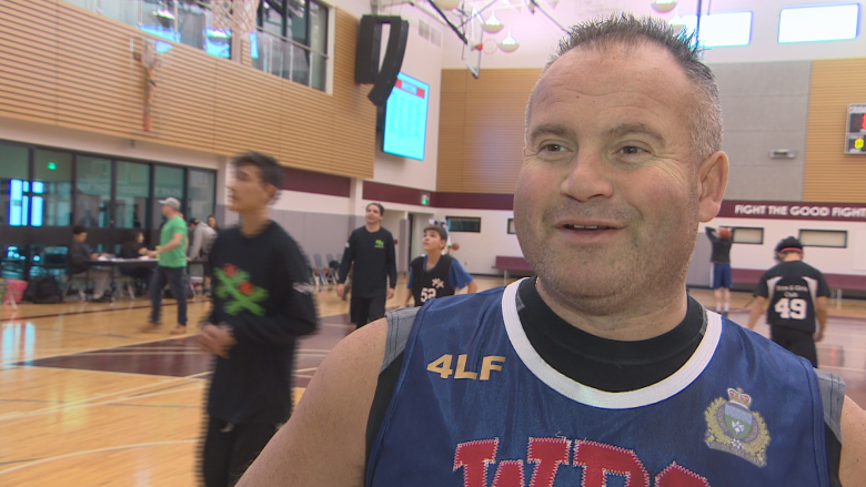 A different kind of court: Police, teens face off at basketball tournament