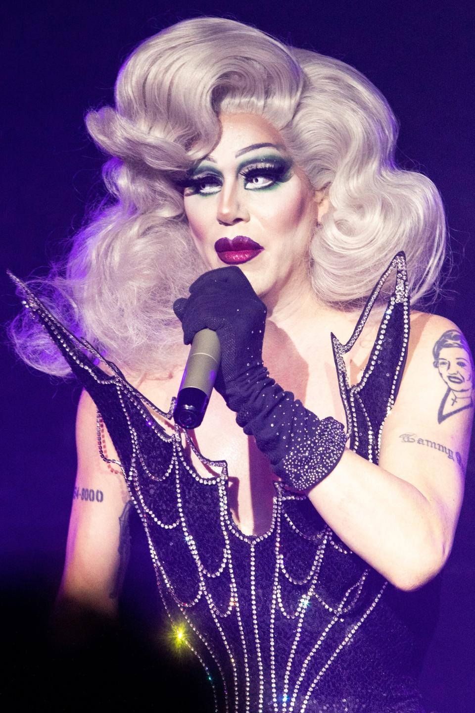 Sharon Needles speaking into a microphone