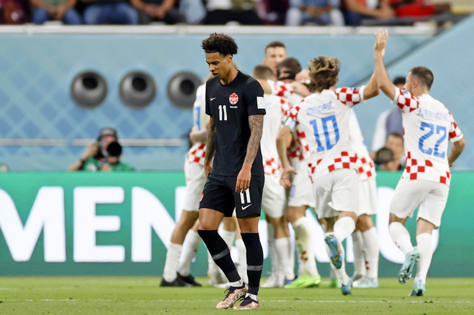 Nov 27, 2022; Doha, Qatar; Canada forward Tajon Buchanan (11) reacts after Croatia forward Marko Livaja (14) scored a goal during the first half of a group stage match during the 2022 World Cup at Khalifa International Stadium. Mandatory Credit: Yukihito Taguchi-USA TODAY Sports